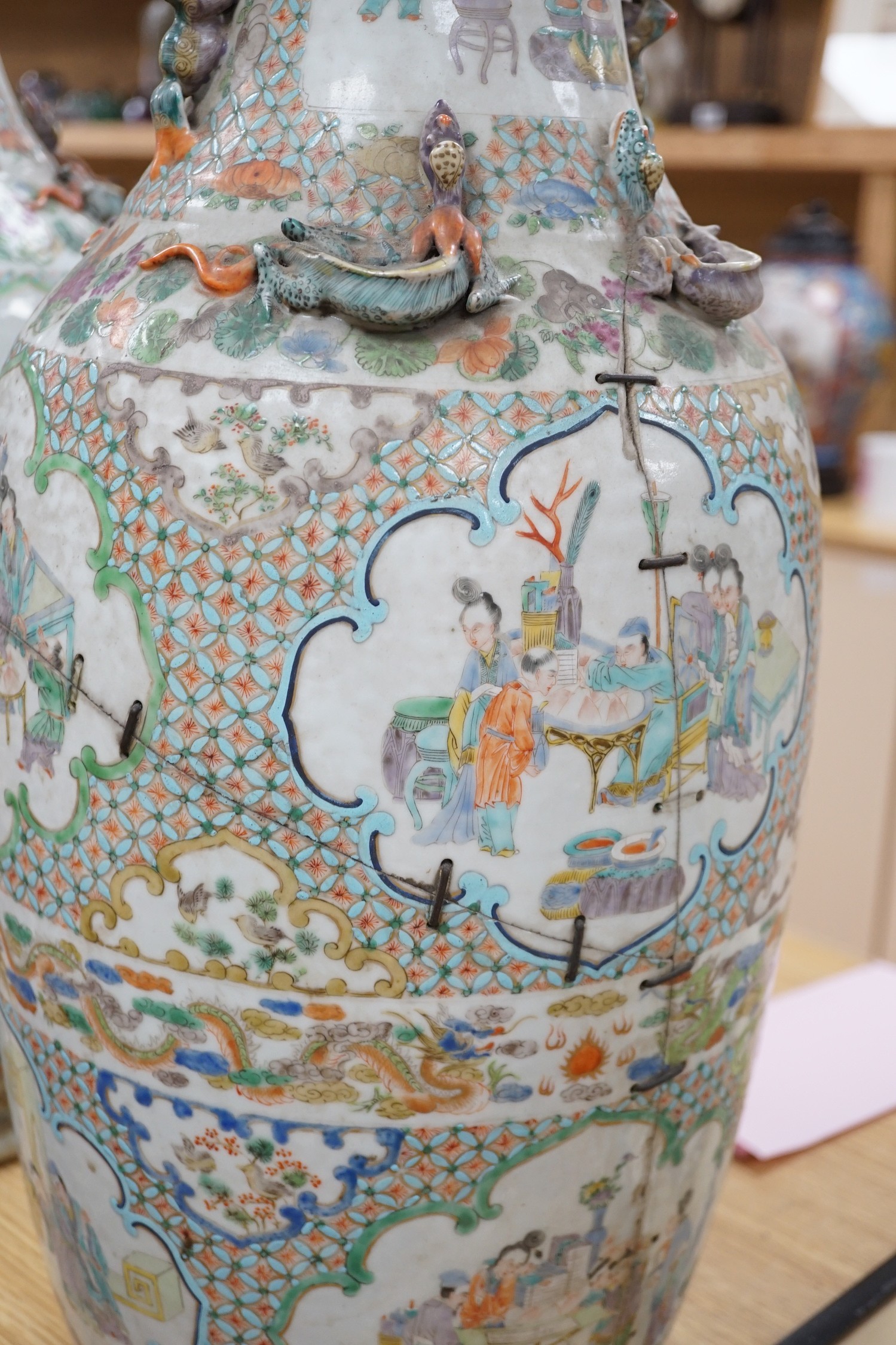 A large pair of Chinese export famille verte dragon vases (in need of restoration), 63cms high
